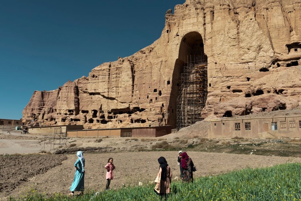 Afghan tourists from Kabul visit the site that housed the famous Buddhas on October 6, 2021 in Bamiyan, Afghanistan. Photo by Marco Di Lauro/Getty Images.