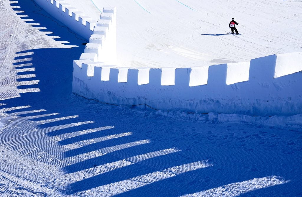 Norwegian snowboarder Mons Roisland practices on the Great Wall of China-themed slopestyle snowboard course at Genting Snow Park in Zhangjiakou, during for the 2022 Beijing Winter Olympic Games. Photo by Xu Chang/Xinhua via Getty Images.
