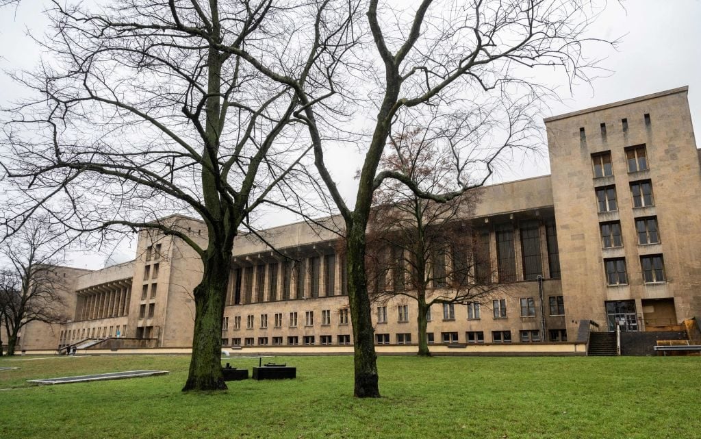 A photo taken on February 3, 2022 shows an exterior view of Berlin's former Tempelhof airport hangar housing the new "Kunsthalle Berlin," Photo: John MacDougall/AFP via Getty Images.