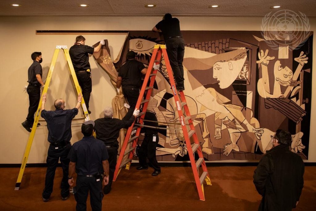 The 25-foot-long tapestry of Pablo Picasso’s Guernica being reinstalled outside the United Nations Security Council Chamber. Courtesy of the United Nations.