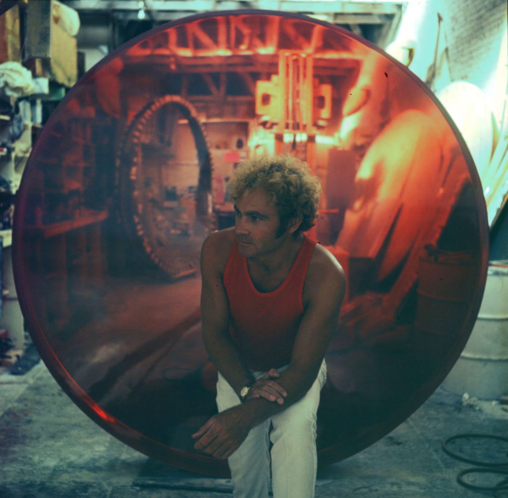 De Wain Valentine in his Venice Beach, California, studio with Red Concave Circle (1970). Photo by Harry Drinkwater, courtesy of Almine Rech, Paris, Brussels, London, New York, and Shanghai.