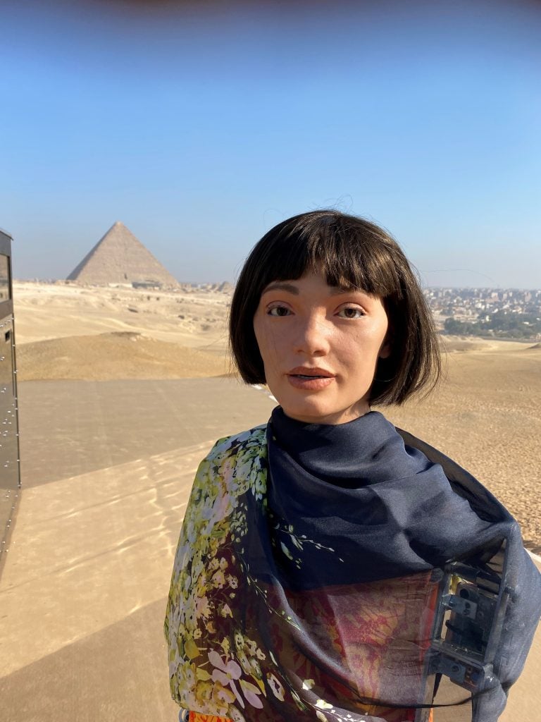 Ai-Da Robot at the Great Pyramids of Giza for "Forever Now." Photo courtesy of Aidan Meller. 