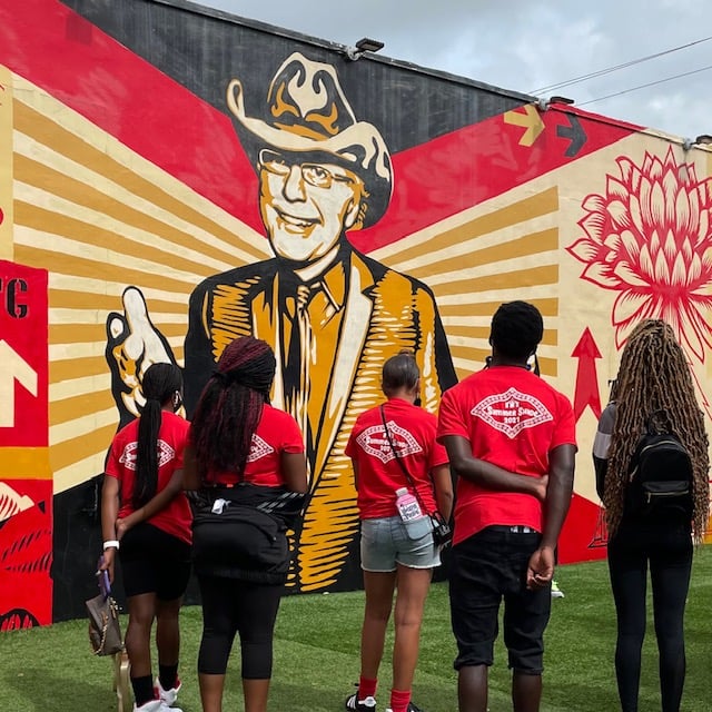 Comic Kids visit Shepard Fairey’s mural is of Tony Goldman the founder of Wynwood Walls. 