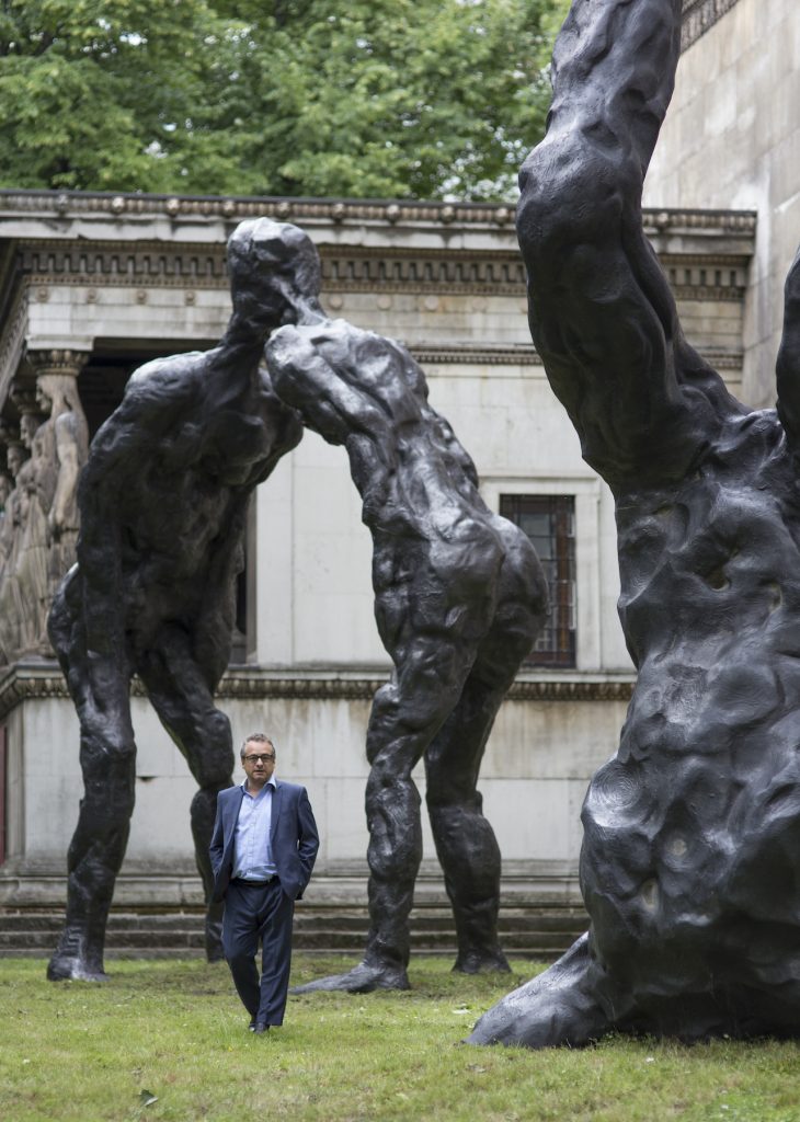 David Breuer-Weil with his towering sculptures at Saint Pancras, London. Photography by Sam Roberts.