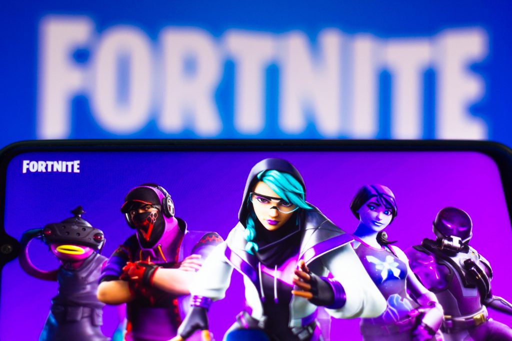 A photo illustration showing the Fortnite logo and select in-game avatars on different screens. (Photo Illustration by Rafael Henrique/SOPA Images/LightRocket via Getty Images)