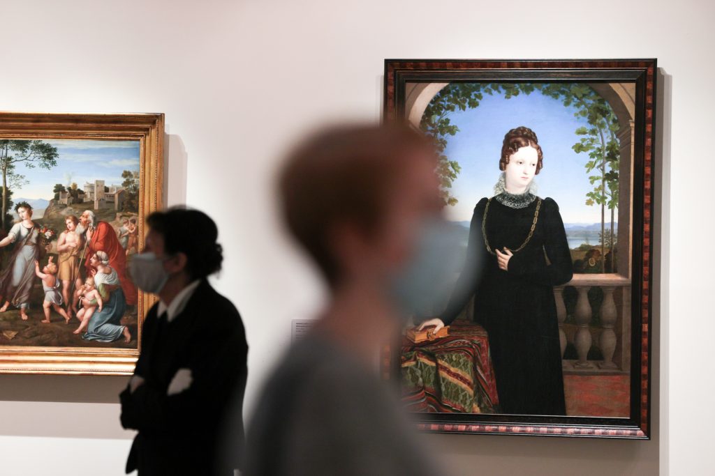 An employee and a visitor at the Gallery of 19th and 20th Century European and American Art at the Pushkin State Museum of Fine Arts. (Photo by Alexander ShcherbakTASS via Getty Images)