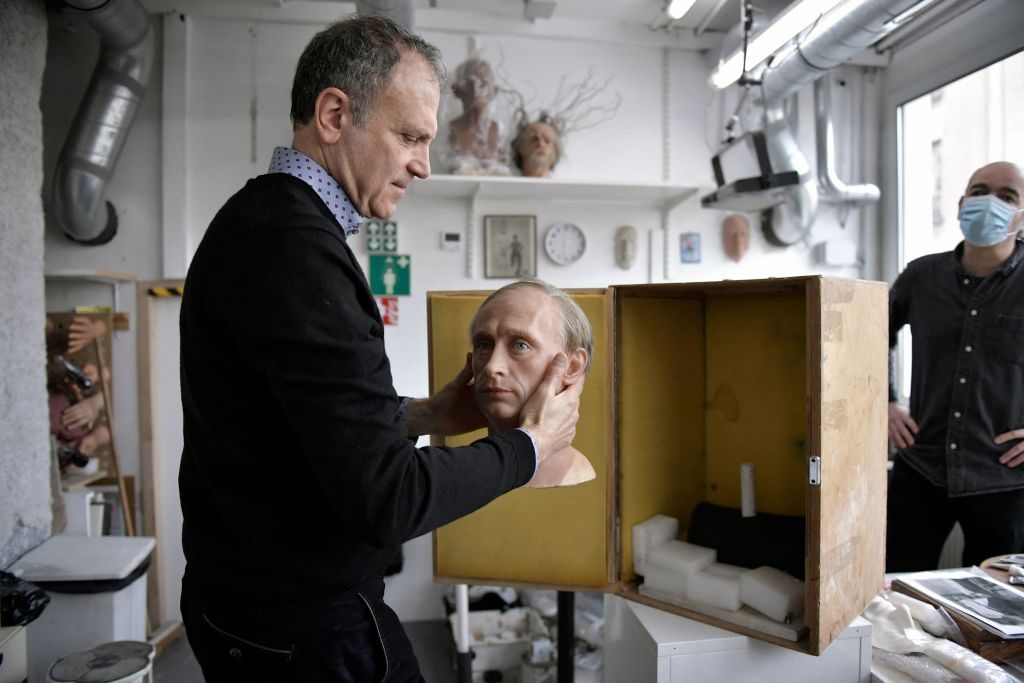 Yves Delhommeau, Musee Grevin's French Director General, packs a wax statue of Russian President Vladimir Putin before it is stored in the reserve, as a reaction to Russia's invasion of Ukraine on March 1, 2022 at the Grevin museum in Paris. Photo by Julien de Rosa/AFP via Getty Images.