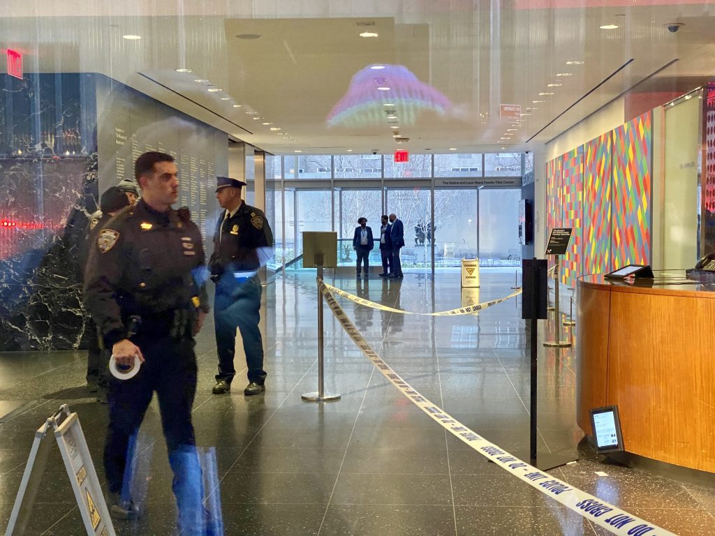Police set out caution tape inside New York's Museum of Modern Art after a stabbing on the premises. Photo by Sarah Cascone.