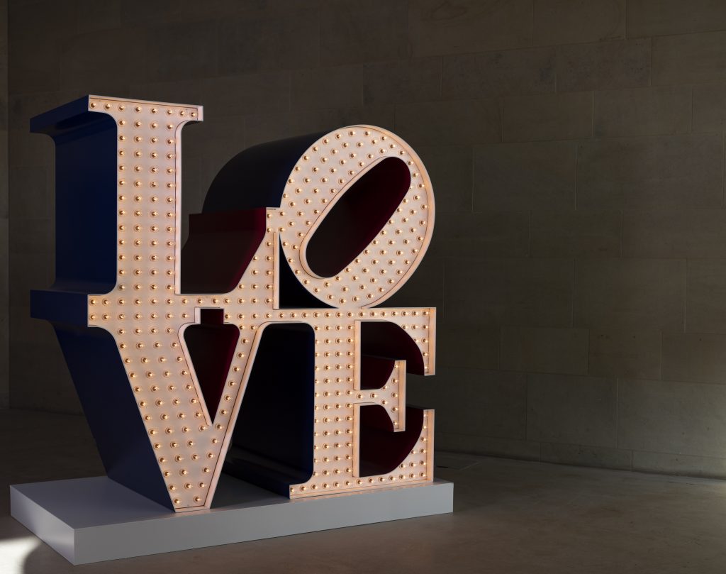 Robert Indiana, The Electric LOVE (1966-2000). Installation view at Yorkshire Sculpture Park, 2022. Photo: © Jonty Wilde, courtesy of Yorkshire Sculpture Park. Artwork: © 2022 Morgan Art Foundation Ltd./ Artists Rights Society (ARS), New York/DACS, London