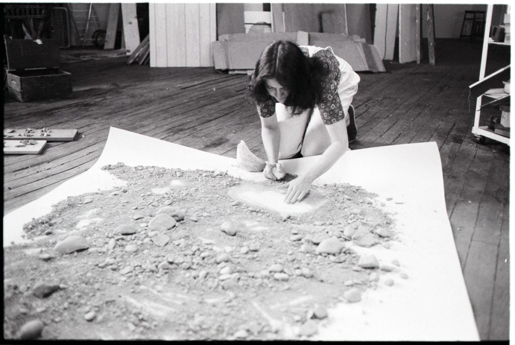 Michelle Stuart working on one of her scrolls. Photo by Lorie Sebastian, courtesy of the artist. 