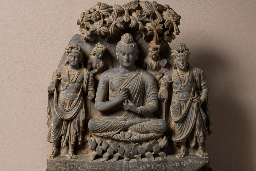 Buddha attended by two bodhisattvas, Gandhara, Peshawar region, Pakistan, inscribed and dated 'Year 5,' possibly equivalent to AD 235 in the reign of Kanishka II. Schist. On loan from a private collection. sold for $6,630,000 at Christies in October 2020. Photo courtesy of the Metropolitan Museum of Art, New York.
