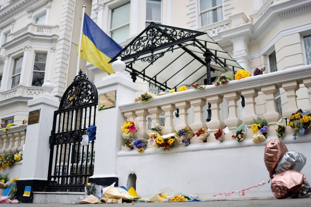 Flowers and messages of support are pictured outside of Ukraine's Embassy in London, on March 4, 2022 following Russia's invasion of Ukraine. (Photo by Tolga Akmen/AFP via Getty Images)