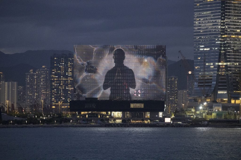 Screening of The Shape of Light on M+ Facade, 2022. Courtesy of Ellen Pau, and M+, Hong Kong. Photo: Lok Cheng, M+, Hong Kong.