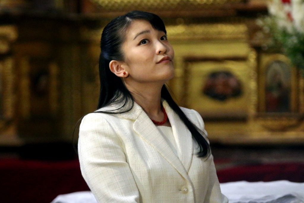 Japanese Princess Mako looks at paintings inside Cusco's cathedral, in Peru, on July 14, 2019. Photo by Juan Sequeiros Fuentes/AFP via Getty Images.