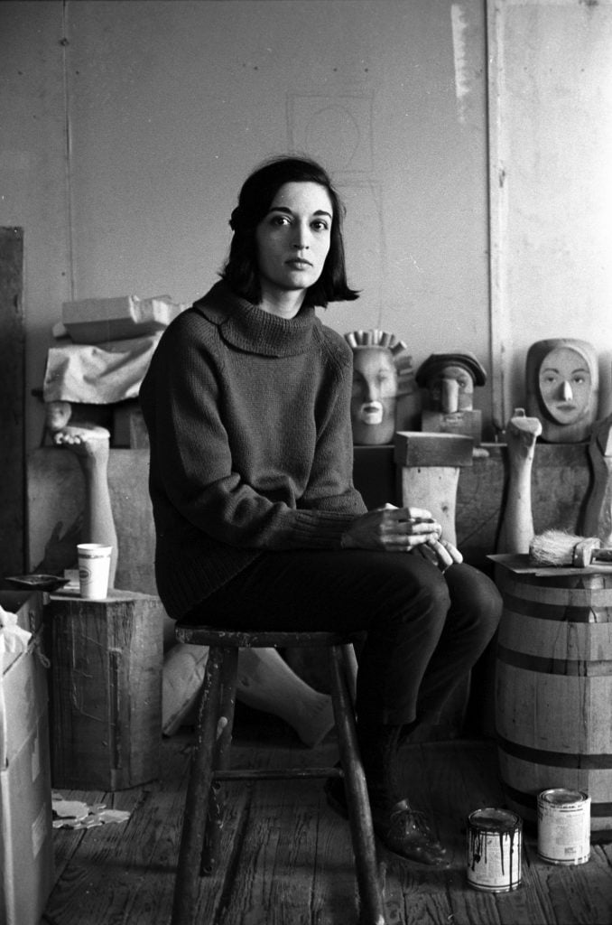Pop art sculptor Marisol Escobar, known as Marisol, in her studio, 1963. Photograph by Ben Martin/Getty Images.