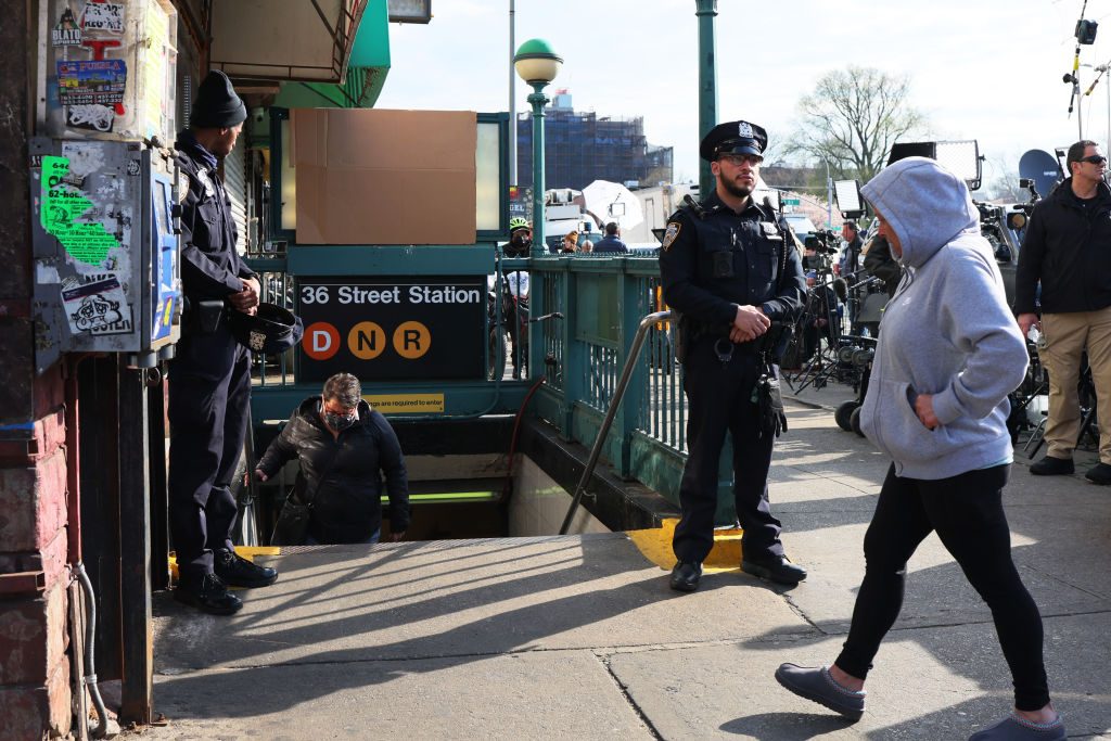 NYPD officers stand guard at the 36 Street subway station on April 13, 2022, after a gunman shot 10 people. (Photo by Michael M. Santiago/Getty Images)