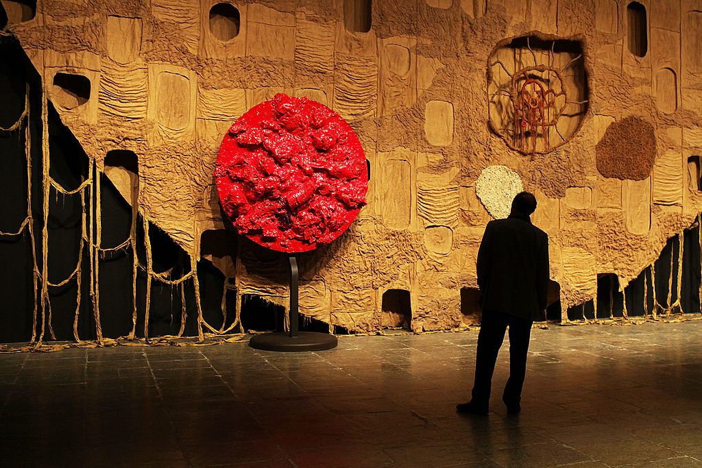 A man looks at artwork at the 2010 Whitney Biennial. (Photo by Spencer Platt/Getty Images)