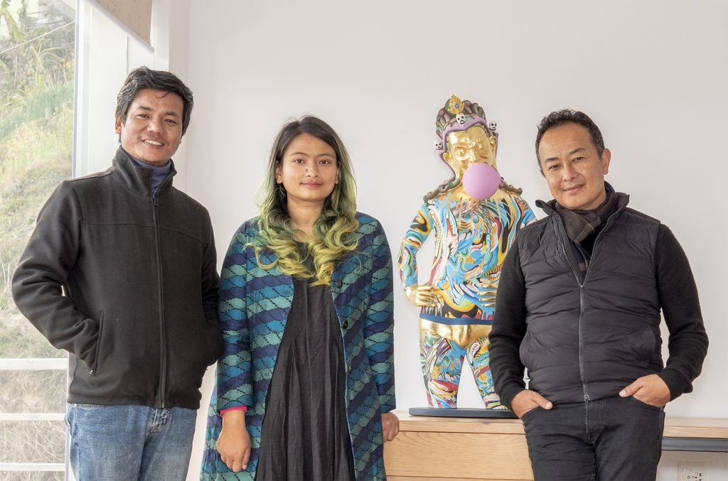Nepal Pavilion curators Hit Man Gurung and Sheelesha Rajbhandari with artist Tsherin Sherpa.