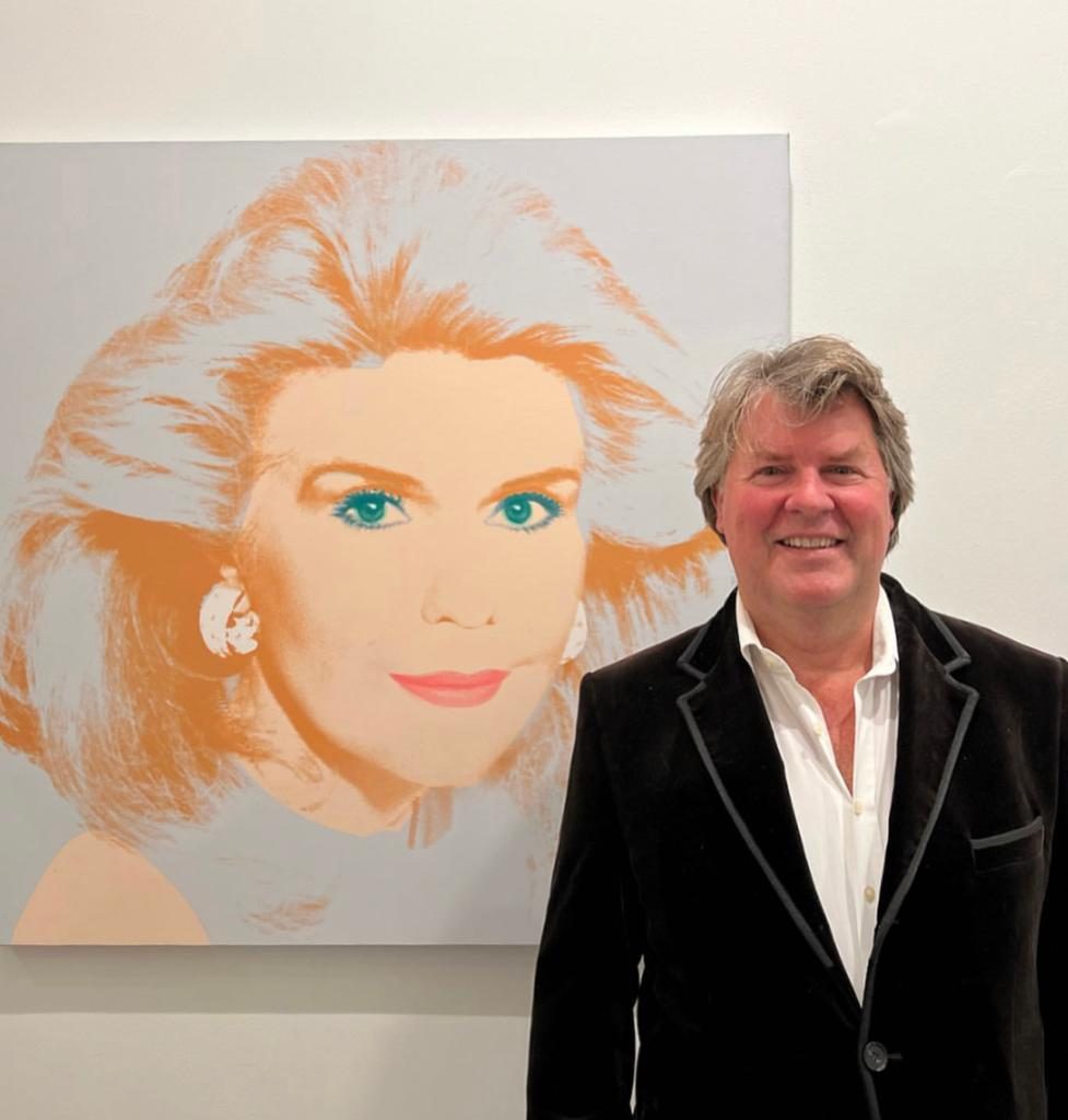 Ben Brown and the Andy Warhol portrait of Mariana Vardinoyannis. Photo by Simon de Pury.