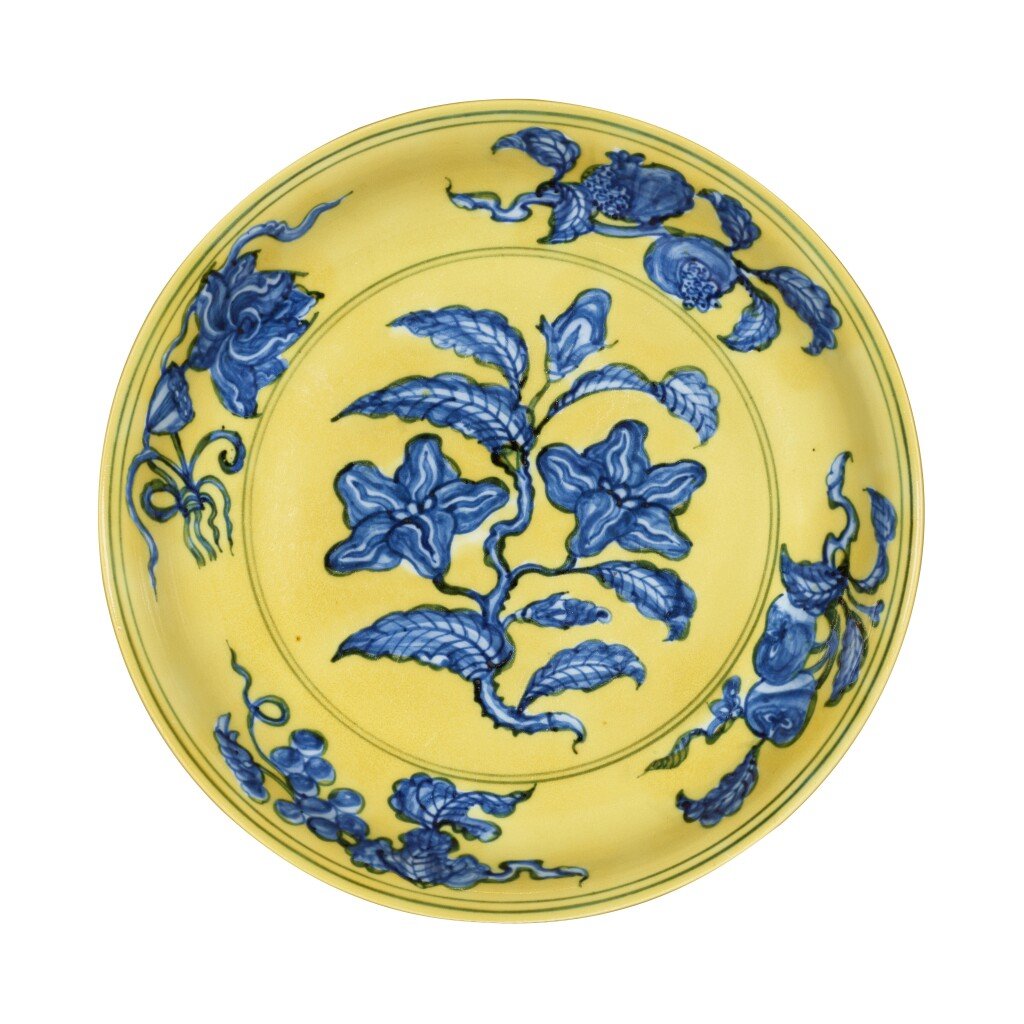A Ming dynasty yellow-ground and underglaze-blue 'gardenia' dish Mark and period of Hongzhi from the collection of Joseph Lau being auctioned at Sotheby's Hong Kong.  Photo courtesy of Sotheby's Hong Kong. 