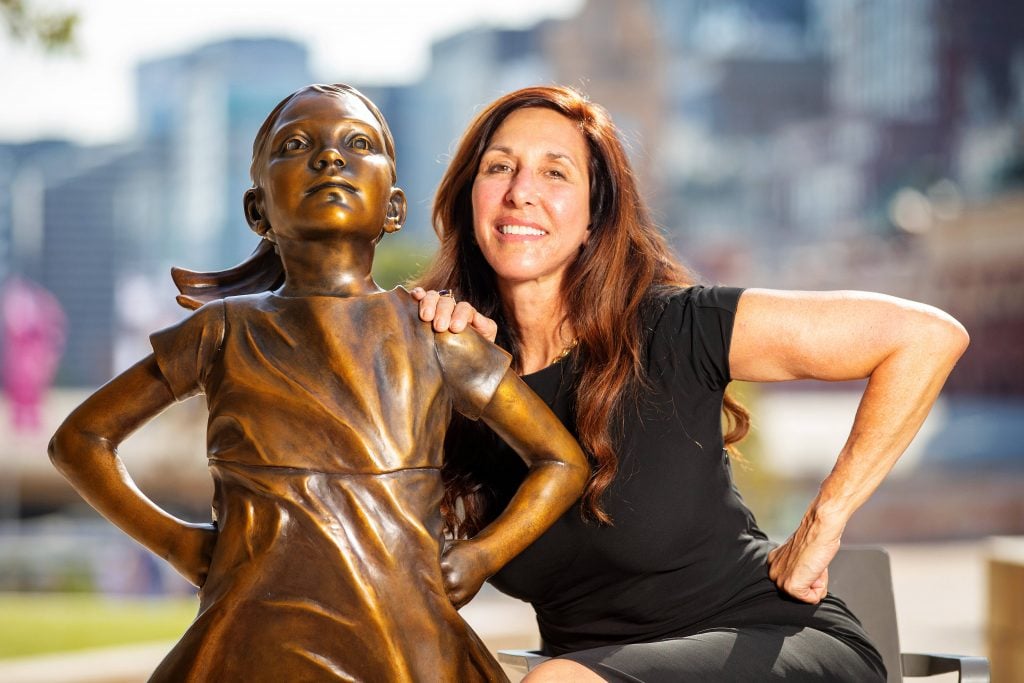 Kristen Visbal with her piece Fearless Girl at Federation Square in Melbourne, Victoria. Photo by Mark Stewart/Newspix.