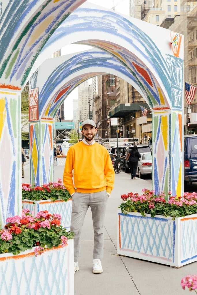 Alexandre Benjamin Navet stands under his colorful arches. Courtesy of Van Cleef & Arpels.