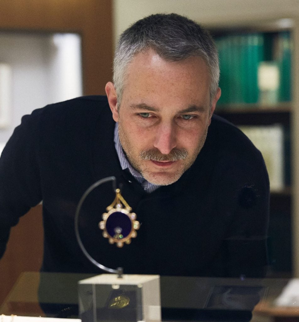 Pablo Bronstein admires a timepiece. Courtesy of Breguet. 