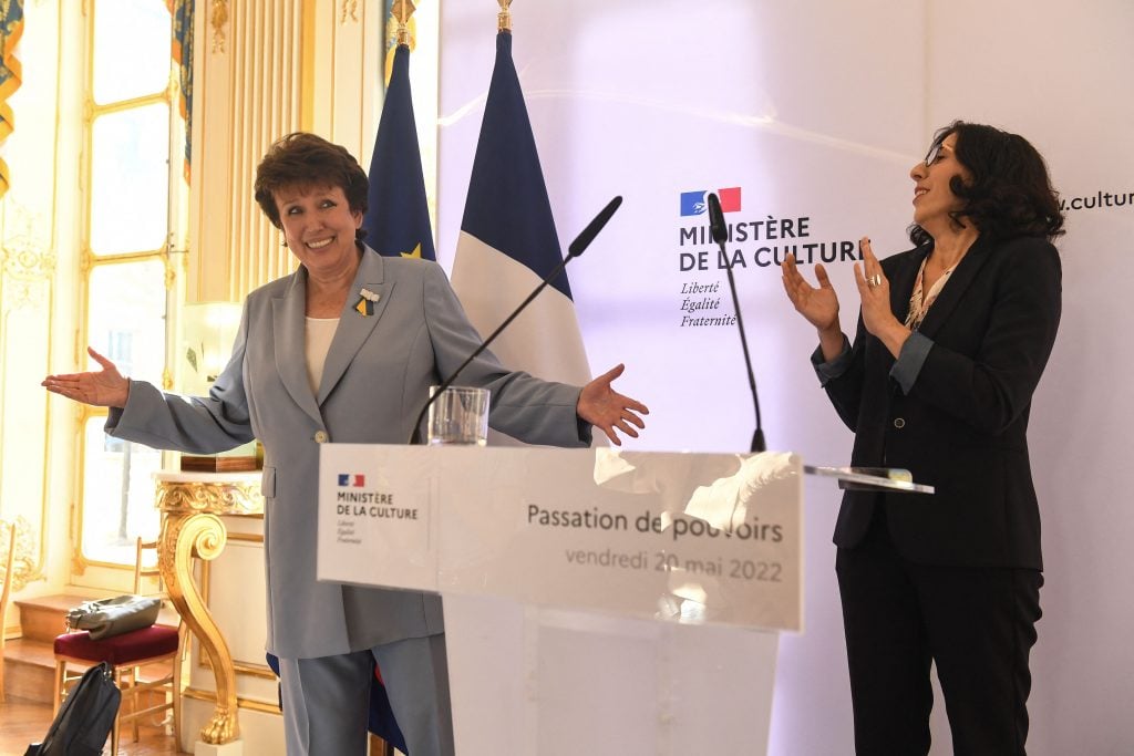 French Culture Minister Roselyne Bachelot reacts after handing over to her successor, Rima Abdul-Malak, during a ceremony at the Ministry of Culture in Paris on May 20, 2022. Photo: JULIEN DE ROSA/AFP via Getty Images.