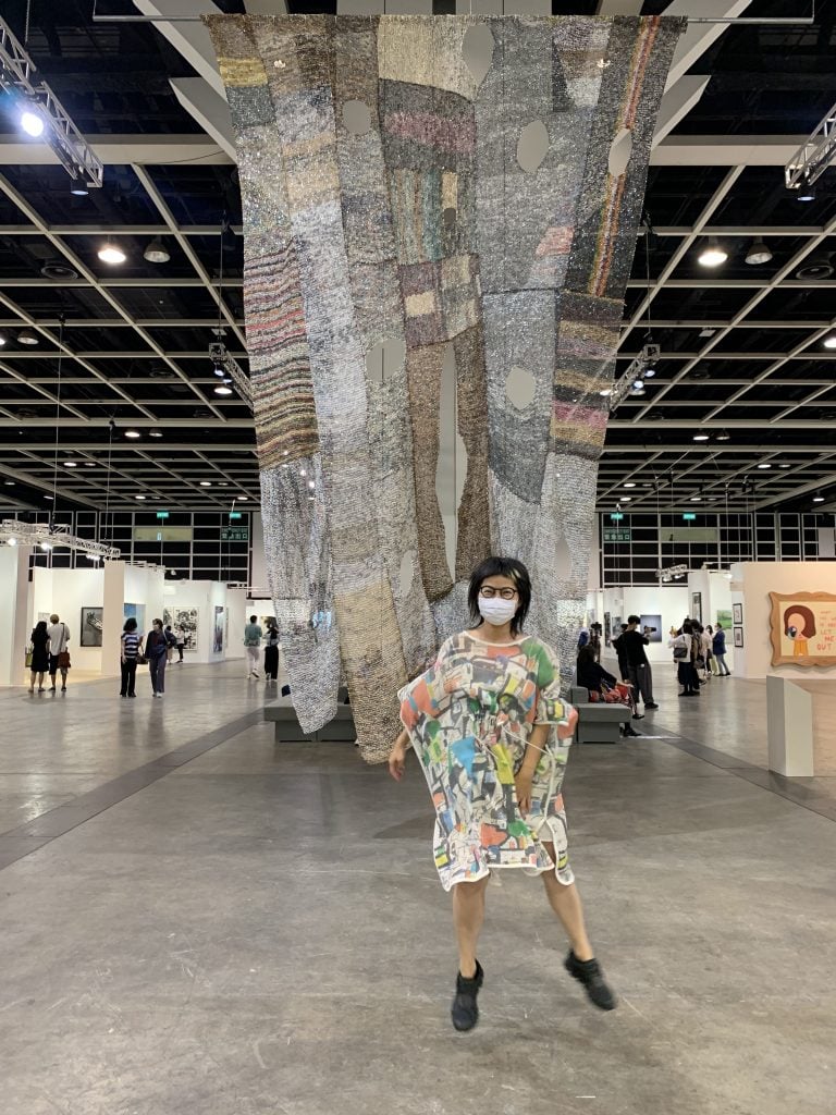 Movana Chen and her work <i>Dreconstructing</i>. ©️ Movana Chen, courtesy of Flowers Gallery, photo by Asia_Art_Hopper.