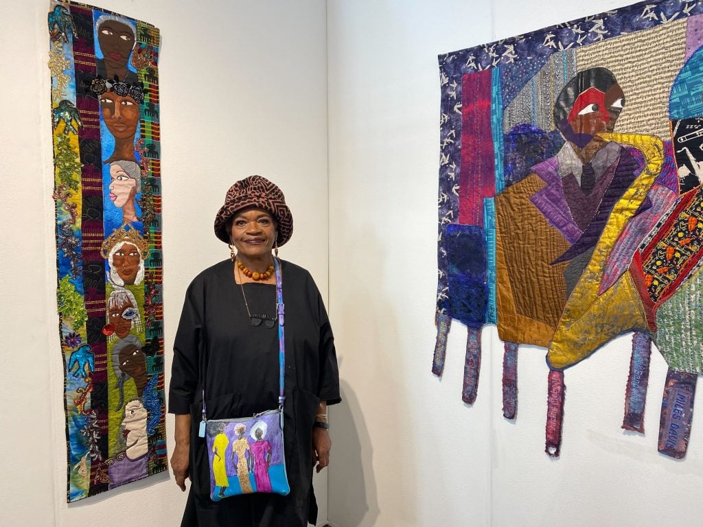 Dindga McCannon with her work at 1-54 New York. Photo by Sarah Cascone.