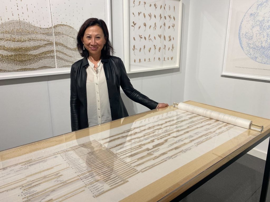 Yu-Wen Wu with her piece Walking to Taipei (2021) and other works presented by Praise Shadows Art Gallery, Boston, at the Independent, New York. Photo by Sarah Cascone.