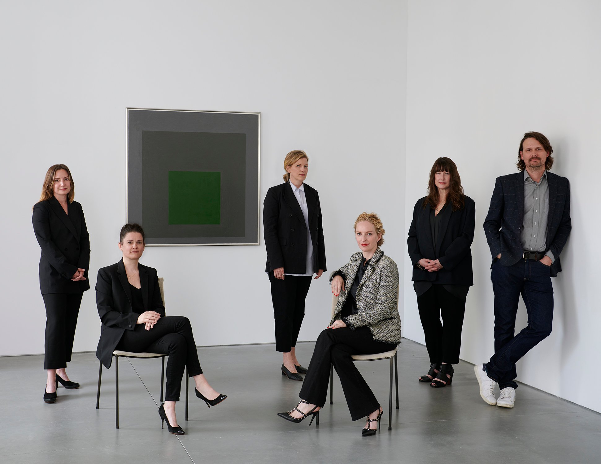 David Zwirner's Secondary Market Department (L to R): Katherine Lukacher, Meghan Hill, Alexandra Whitney, Kristine Bell, Kelly Reynolds, Cy Amundson. In the background is Josef Albers's Homage to the Square: Embedded (1963). © The Josef and Anni Albers Foundation / Artists Rights Society (ARS), New York. Courtesy of the Josef and Anni Albers Foundation and David Zwirner.  Photo: Jason Schmidt.