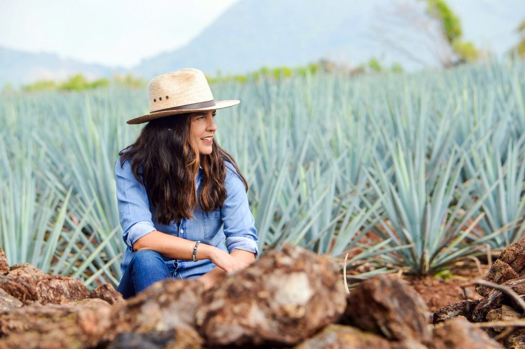 Bertha González Nieves, founder of Casa Dragones, in the agave fields. Photo courtesy of Casa Dragones.