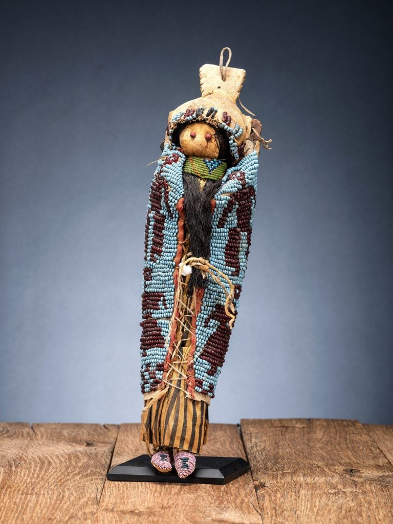 Rare Wasco or Yakima beaded pictorial hide doll cradle with doll from the collection of Forrest Fenn, estimated at $15,000 to $25,000. Photo courtesy of Hindman, Chicago.