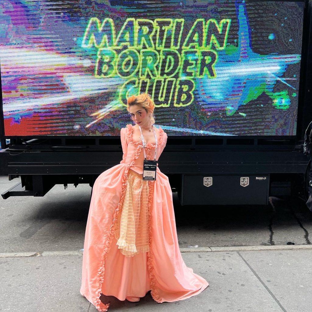 Elle Lexxa, a TikTok personality and antique jewelry enthusiast, came to NFT.NYC in an 18th-century-style gown. She said that creating digital tokens for her jewelry designs will help her reach a larger audience. Photo: Katya Kazakina