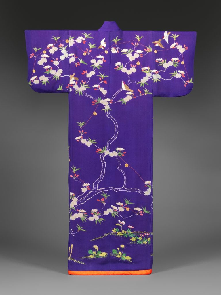 Court lady’s robe (kosode) with swallows and bells on blossoming cherry tree. Meiji period (1868–1912), mid-19th century. Crepe silk with silk embroidery and couched gold thread. Courtesy of the Metropolitan Museum of Art.