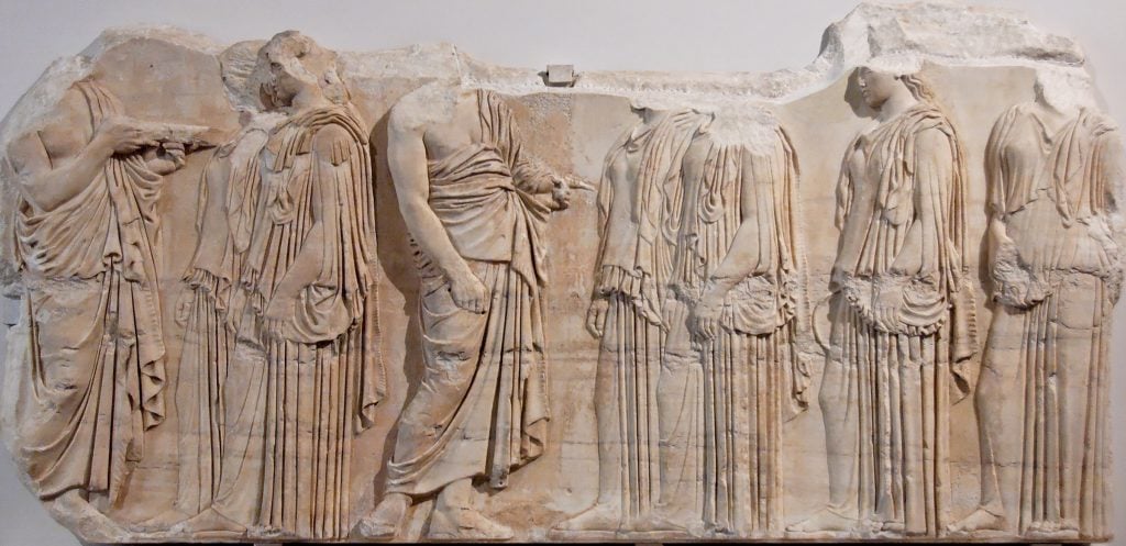 Ergastinai (“weavers”) block, from the east frieze of the Parthenon in Athens. Traces of ancient polychromy, Pentelic marble, c. 445–435 B.C. (Wikipedia)