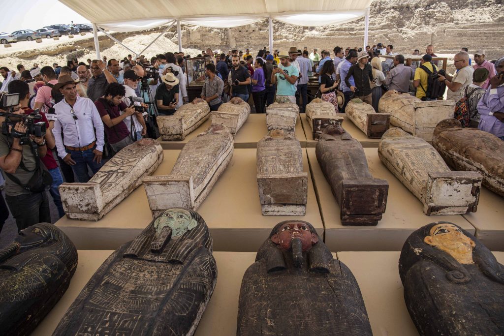 Sarcophaguses found in a cache at the Saqqara necropolis. Photo by Mahmoud El-Khawas/picture alliance via Getty Images.