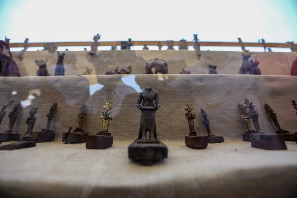 The bronze statuettes discovered at Saqqara. Photo by Ziad Ahmed/NurPhoto via Getty Images.