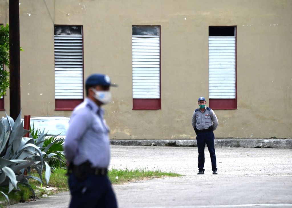 Police officers guard the entrance to the Marianao Municipal Court in Havana, on May 31, 2022, where the trials of Cuban dissident artists Luis Manuel Otero Alcántara and Maykel Castillo. Photo: Yamil Lage/AFP via Getty Images.