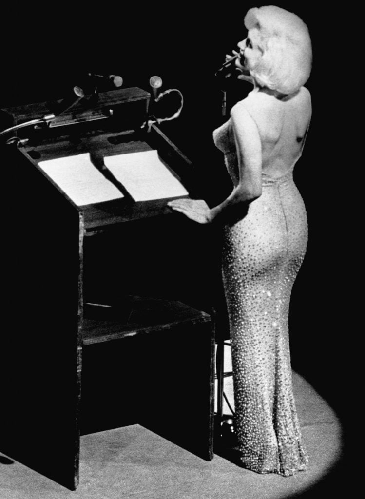 Actress Marilyn Monroe sings "Happy Birthday" to President John F. Kennedy at Madison Square Garden, for his upcoming 45th birthday, on May 20, 1962. Photo from Bettman via Getty Images. 