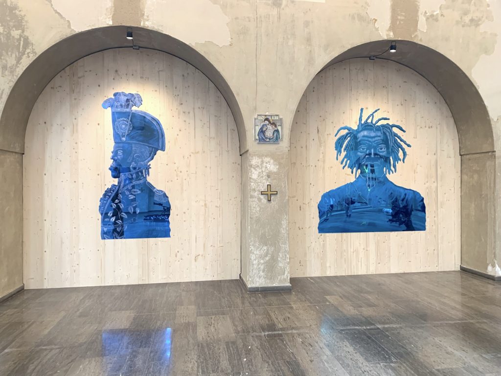 Two works from Edouard Duval-Carrié's "The Black President" series at the church of St. Kunigundus. Photo by Ben Davis. 