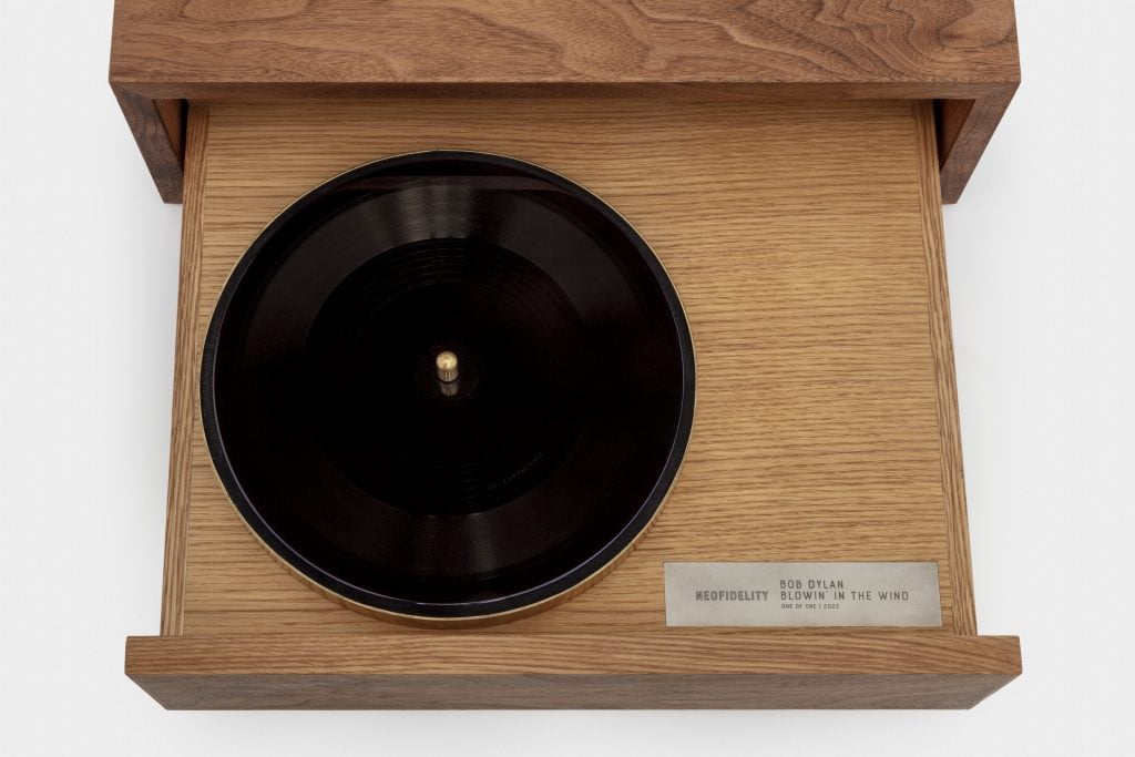 A NeoFidelity Ionic Original acetate disc of a 2021 Bob Dylan recording of "Blowin’ in the Wind" with custom walnut and white oak cabinet. Photo courtesy of Christie's London. 