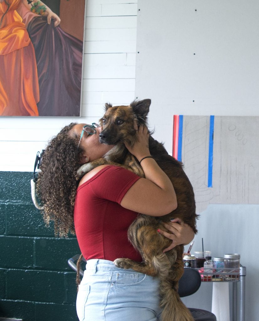Danielle De Jesus and her dog Spooky at the Beecher Residency studio. Photo courtesy of the artist.