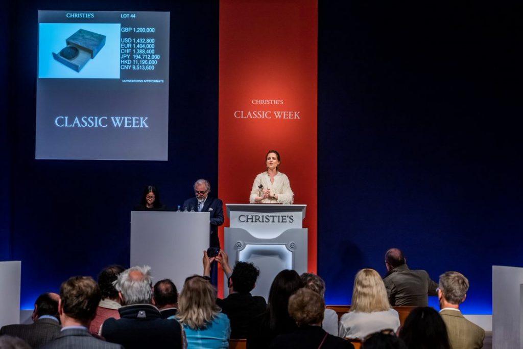 Auctioneer Arlene Blankers, Christie’s business manager decorative arts, auctioning the unique Bob Dylan record. Photo courtesy of Christie's London.