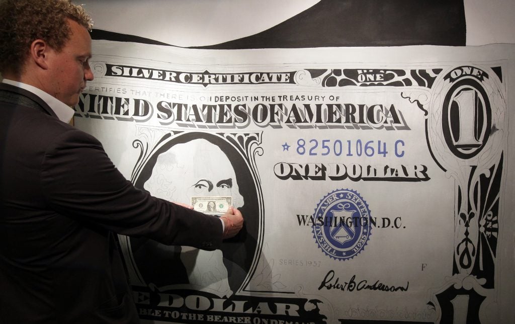 Andy Warhol's One Dollar Bill (Silver Certificate) (1962) shown at the media preview of the summer auction at Sotheby's Hong Kong in May 2015. (Photo by Dickson Lee/South China Morning Post via Getty Images)