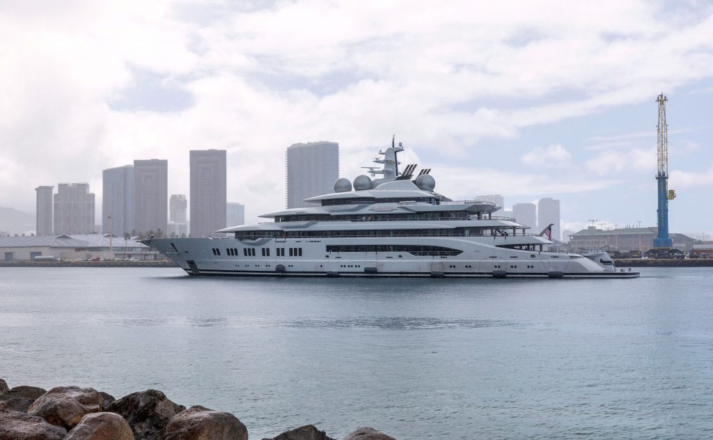 The yacht <em>Amadea</em>, which the U.S. believes belongs to sanctioned Russian oligarch Suleiman Kerimov, seized by the Fiji government at the request of the U.S., arrives at the Honolulu Harbor, Hawaii. Photo by Eugene Tanner/AFP via Getty Images.