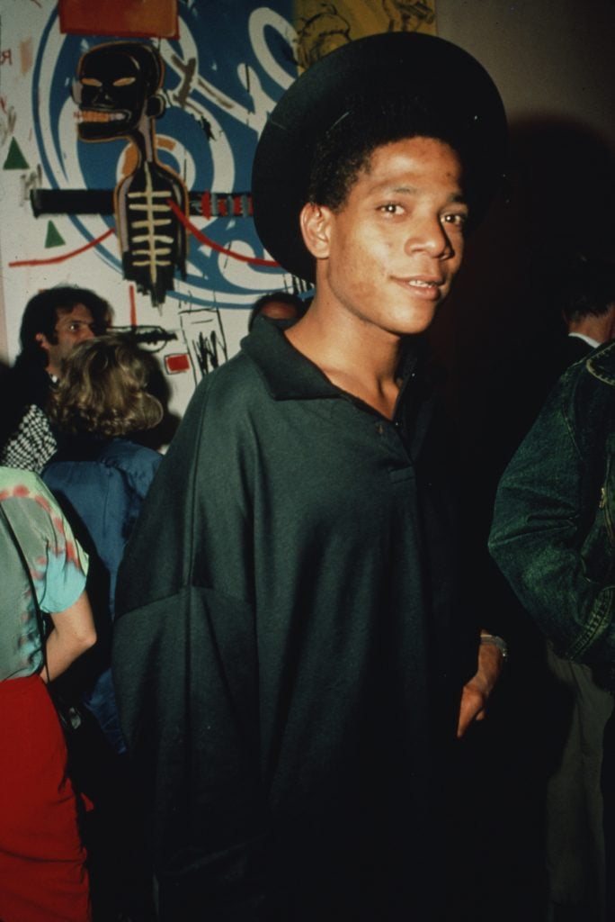 American artist Jean-Michel Basquiat, circa 1985. Photo by Rose Hartman/Getty Images.