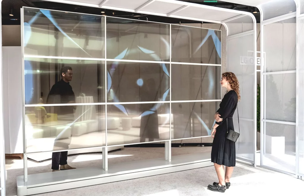 Kevin McCoy, <em>Quantum Leap: Dark Star</em> on view on nine Transparent OLED Signage screens at Frieze New York 2022. Photo courtesy of LG. 