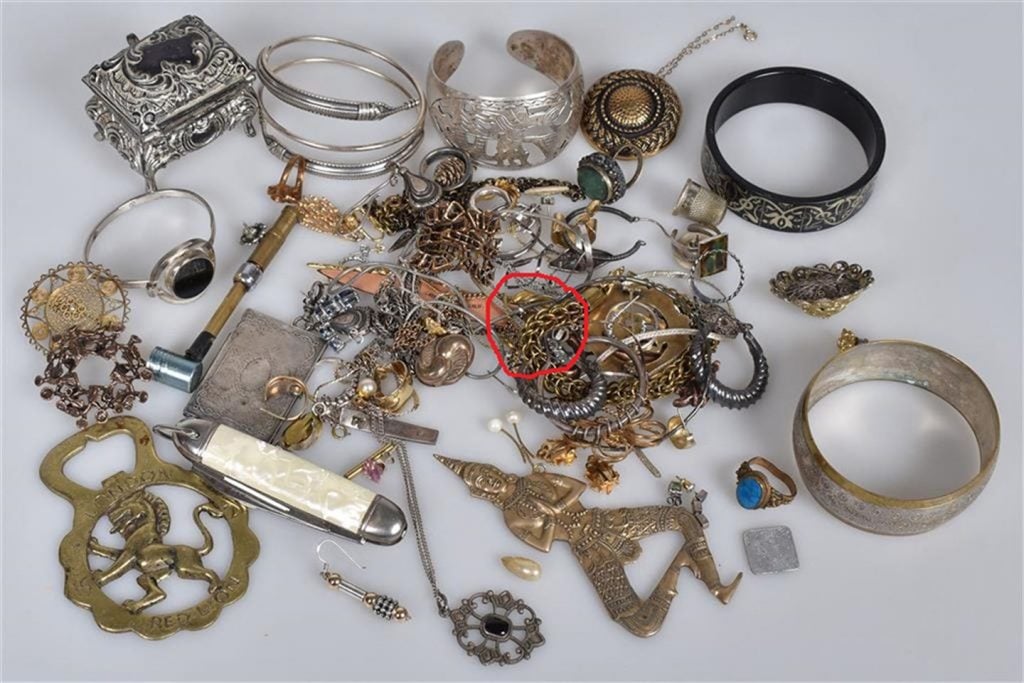 The gold Viking Age ring is circled in red among the rest of the haul. Photo: Vestland County Municipality.